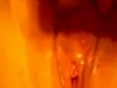 Her love tunnel soaks with love juice as the wife caresses her tender love button.